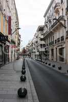 The narrow shopping street of the Mediterranean town