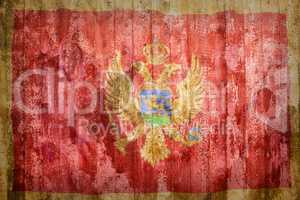 Grunge style of Montenegro flag on a brick wall