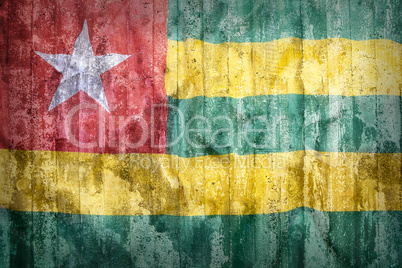 Grunge style of Togo flag on a brick wall
