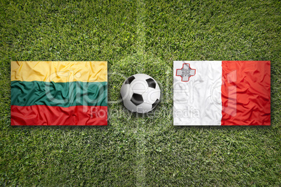 Lithuania vs. Malta flags on soccer field