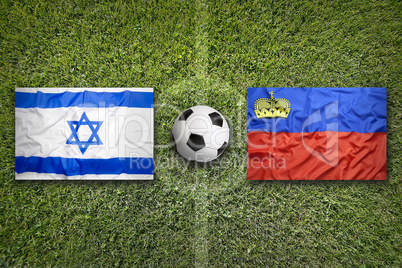 Israel vs. Liechtenstein flags on soccer field