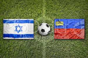 Israel vs. Liechtenstein flags on soccer field