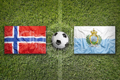 Norway vs. San Marino flags on soccer field