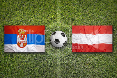 Serbia vs. Austria flags on soccer field