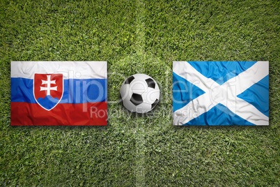 Slovakia vs. Scotland flags on soccer field