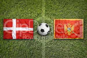 Denmark vs. Montenegro flags on soccer field