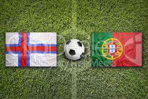 Faroe islands vs. Portugal flags on soccer field