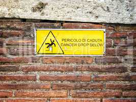 Danger sign on a brick wall