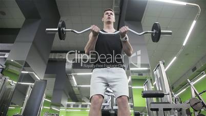 Close-up of a man performs gym exercises