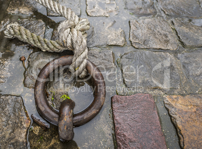 Mooring ring with rope tied on it