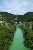 Isonzo (Soca) river and the stone Salcan bridge