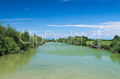 Summer view of a quiet river in the Venetian Plain