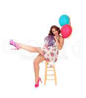 Happy woman with two balloons.