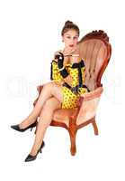 Beautiful woman in armchair.
