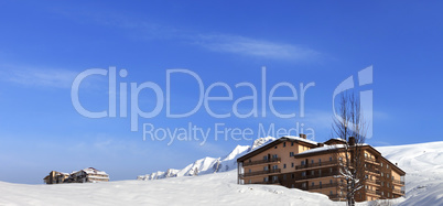 Panoramic view on hotels in winter mountains