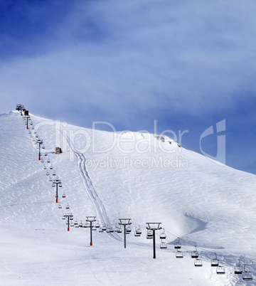 Ski slope and chair-lift at morning