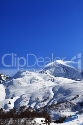 Mount Tetnuldi and off-piste slope with track from ski and snowb