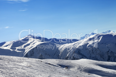 Ski slope in sunny morning