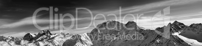 Black and white panorama of winter mountains