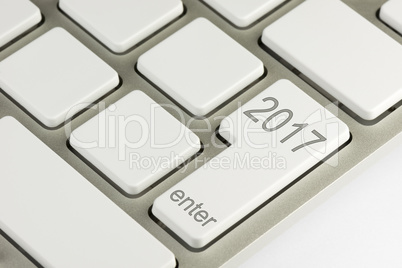 Keyboard detail with two thousand seventeen on the enter button.