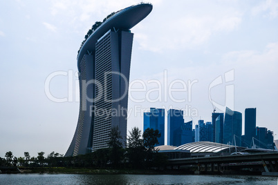 Evening view of Singapore. Beautiful skyscrapers and gold lights.