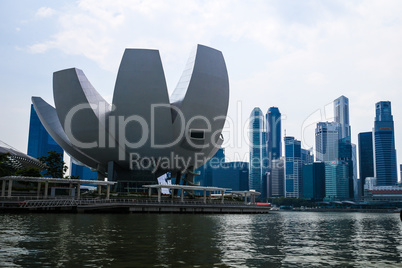 Evening view of Singapore. Beautiful skyscrapers and gold lights.