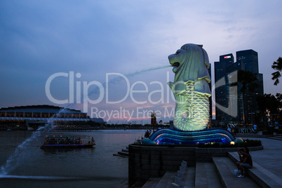 Evening view of Singapore. Beautiful skyscrapers and gold lights.