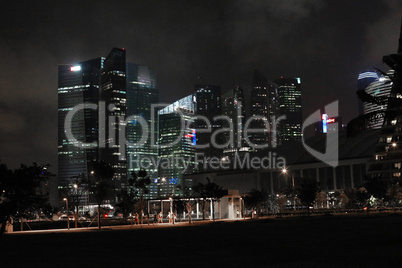 Evening view of Singapore. Beautiful skyscrapers and gold lights.