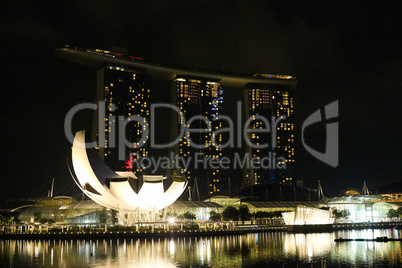 Evening view of Singapore. Beautiful skyscrapers and gold lights.