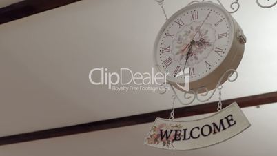 Clock And Welcome Sign