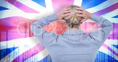 Composite image of rear view of worried businesswoman holding her head