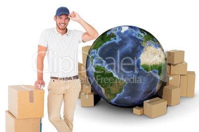 Composite image of happy delivery man leaning on trolley of boxes Composite image of happy delivery man leaning on trolley of boxes