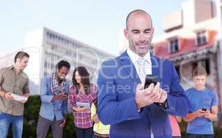 Composite image of smiling businessman using mobile phone