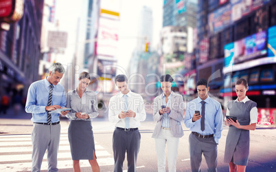 Composite image of business people using their phone
