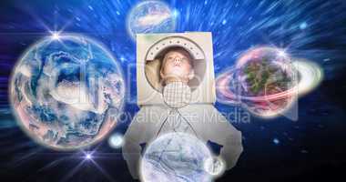 Composite image of boy pretending to be an astronaut
