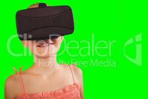 Composite image of close-up of girl wearing virtual simulator