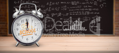 Composite image of alarm clock over white background