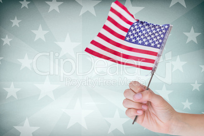 Cropped image of hand holding American flag