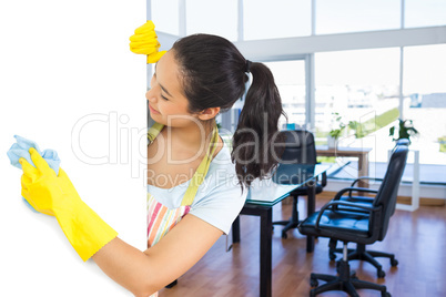 Composite image of laughing woman who washes plate form the side