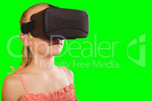 Composite image of girl wearing virtual reality headset