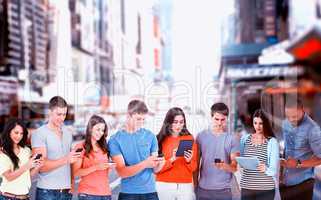 Composite image of four friends standing to the side slightly sending texts