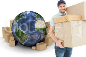 Composite image of happy delivery man carrying cardboard boxes