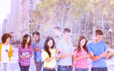 Composite image of four friends standing to the side slightly sending texts