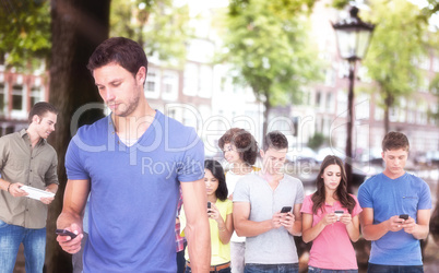 Composite image of man using his mobile phone