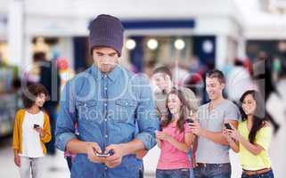 Composite image of hipster using mobile phone