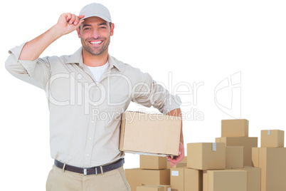 Composite image of portrait of happy delivery man with cardboard box wearing cap