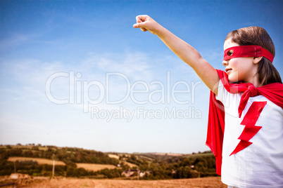 Composite image of girl in red cape playing