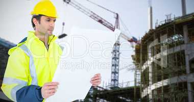 Composite image of architect analyzing blueprint over white background