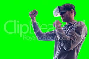Composite image of man wearing virtual reality headset while boxing