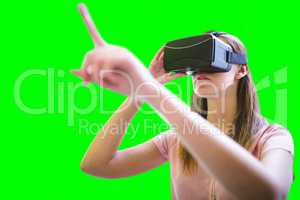 Composite image of woman using a virtual reality device